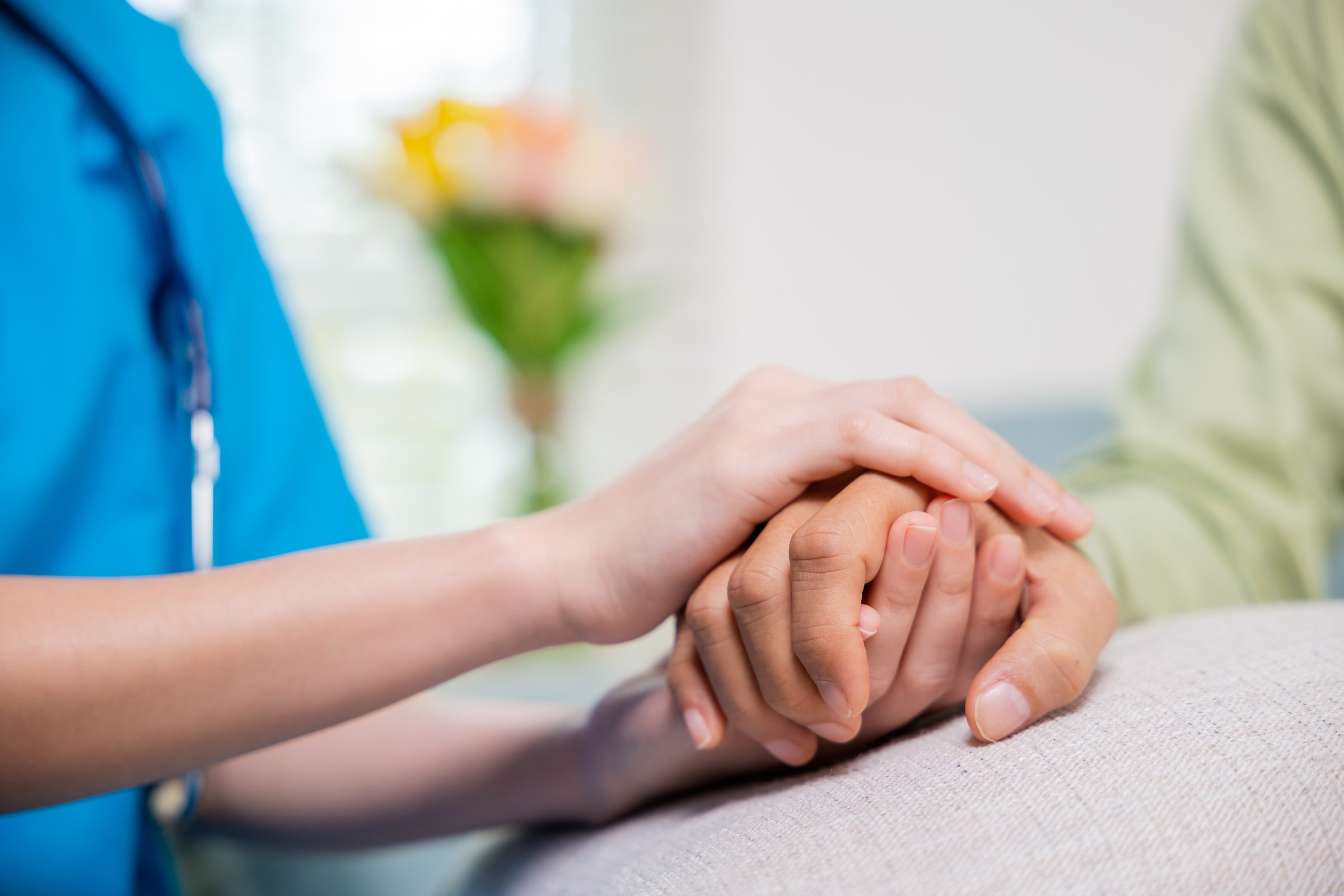 Young woman helping hold hands offering her senior man